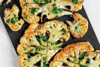 Vegan Roasted Cauliflower Steaks with Garlic-Herb Sauce