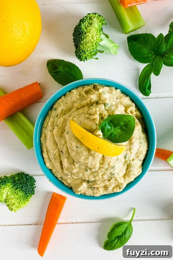 Garden Fresh Basil Hummus Recipe 2 bowl of hummus with cut up veggies