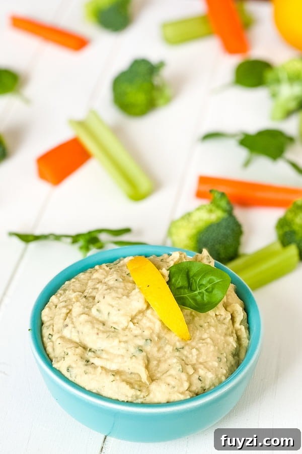 Garden Fresh Basil Hummus Recipe 5 dip with carrots, celery and broccoli