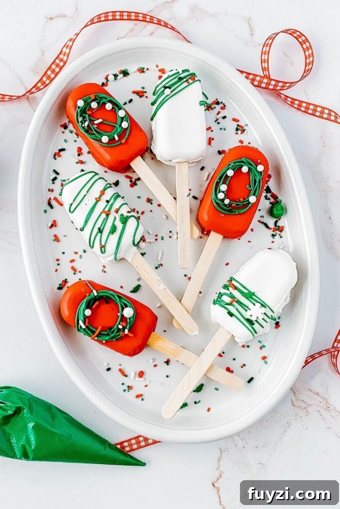 How to Make Festive Christmas Cakesicles 5 Christmas desserts on a tray