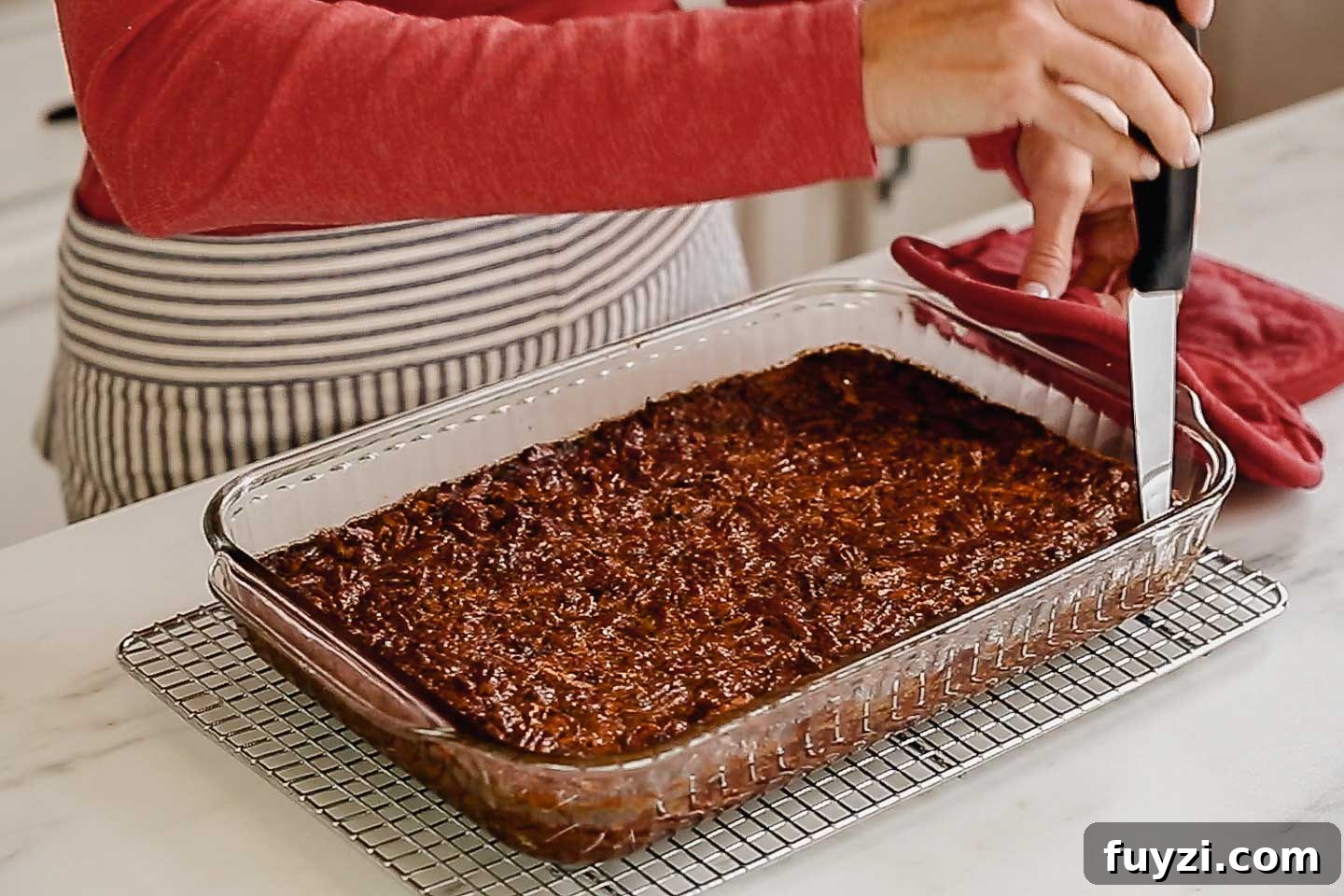 Pecan Pie Bars Recipe: Buttery Shortbread Squares 5 Pecan pie bars cooling in a pan.