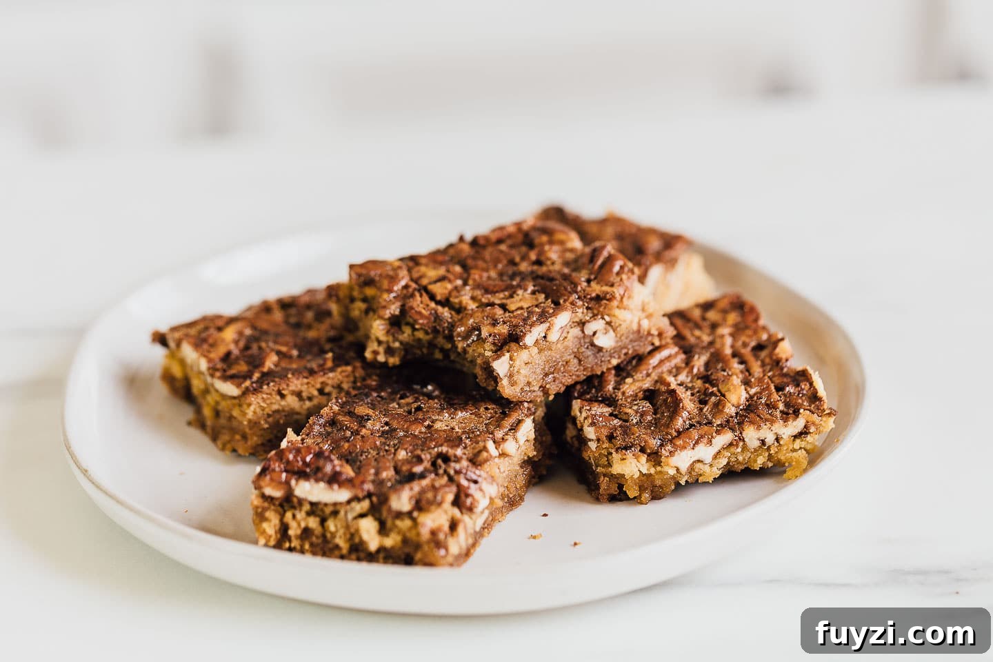 Pecan Pie Bars Recipe: Buttery Shortbread Squares 6 Stack of pecan pie bars ready to serve.