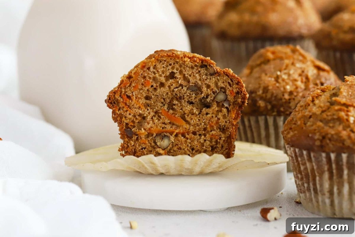A gluten-free carrot cake muffin cut in half