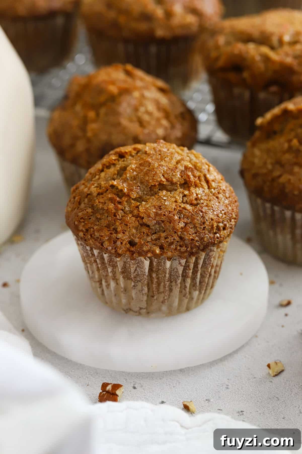 Gluten-free carrot cake muffins topped with sparkling sugar