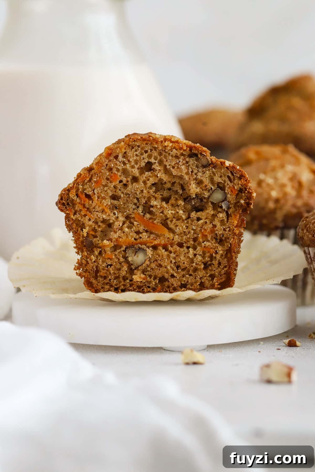 A gluten-free carrot cake muffin cut in half