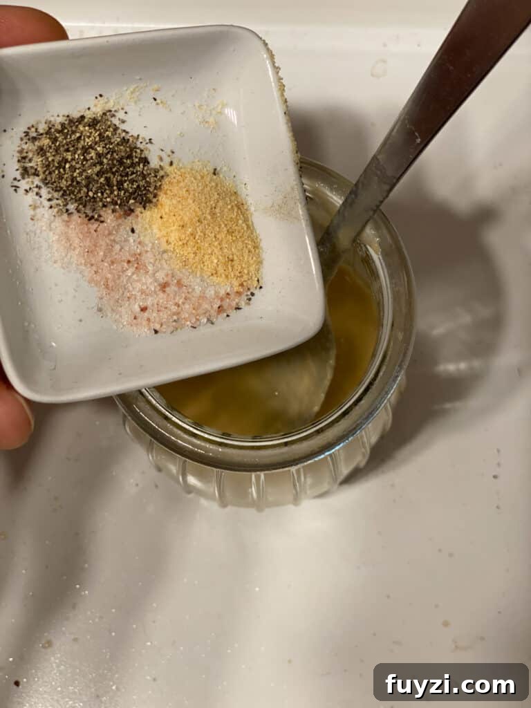 Zesty Vegan Lentil and Chickpea Salad 12 process shot of adding spices to jar