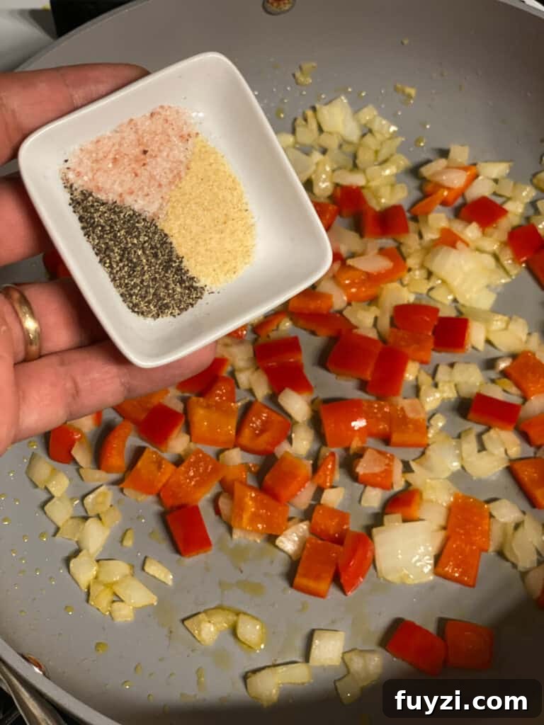 Zesty Vegan Lentil and Chickpea Salad 7 process shot of adding spices to a pan
