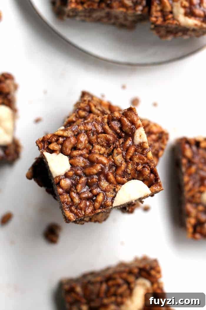 Close-up of peppermint chocolate rice krispie treats showing chewy texture and chocolate chips