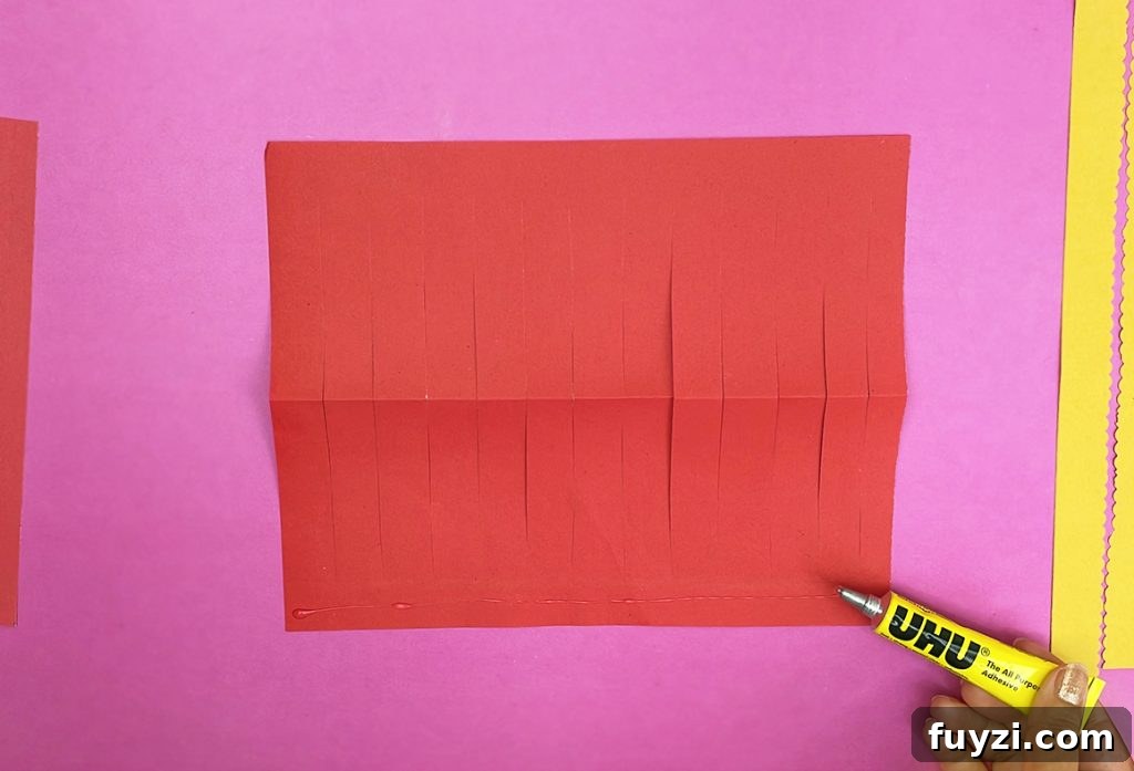 How to Make a Hanging Paper Lantern 12 Gluing decorative strips