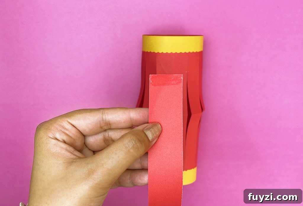 How to Make a Hanging Paper Lantern 17 Gluing the handle inside the lantern