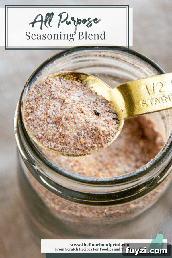 A jar of all purpose seasoning with a spoon