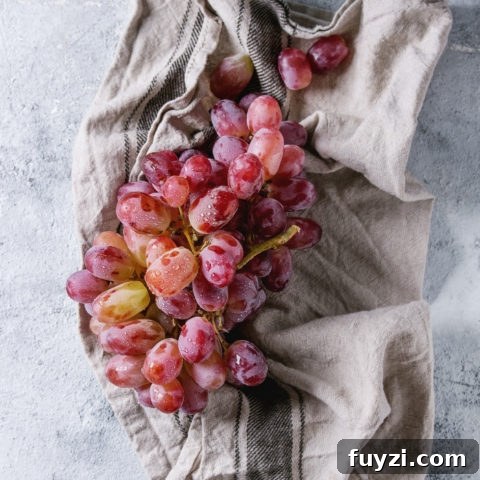15 Nutritious Snacks to Kickstart Your New Year 9 Bunch of red grapes being prepared for freezing