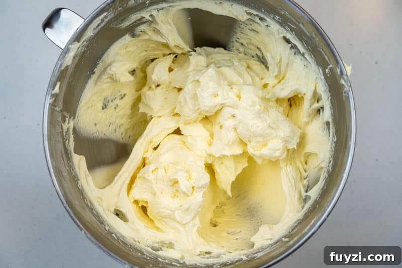Adding the icing sugar & vanilla