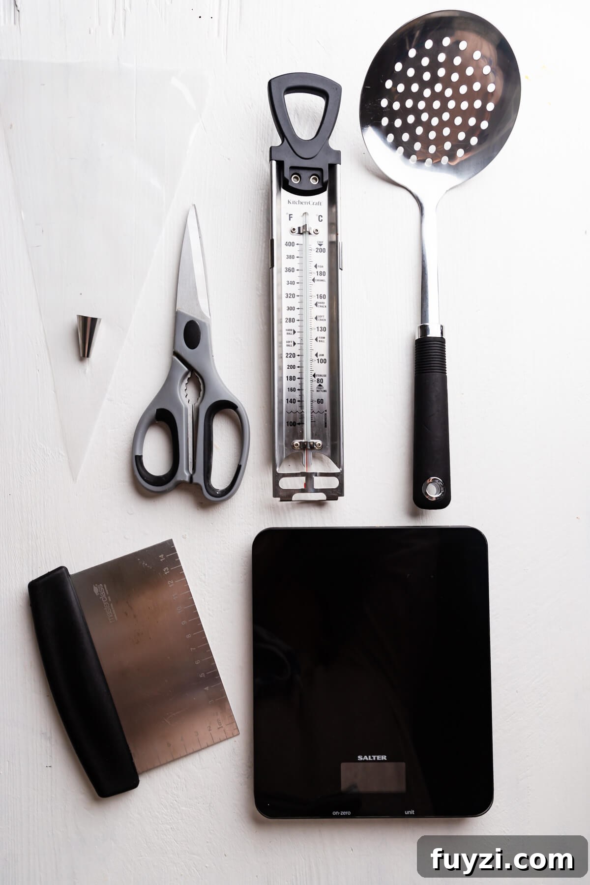 top view of the kitchen utensils on a white board