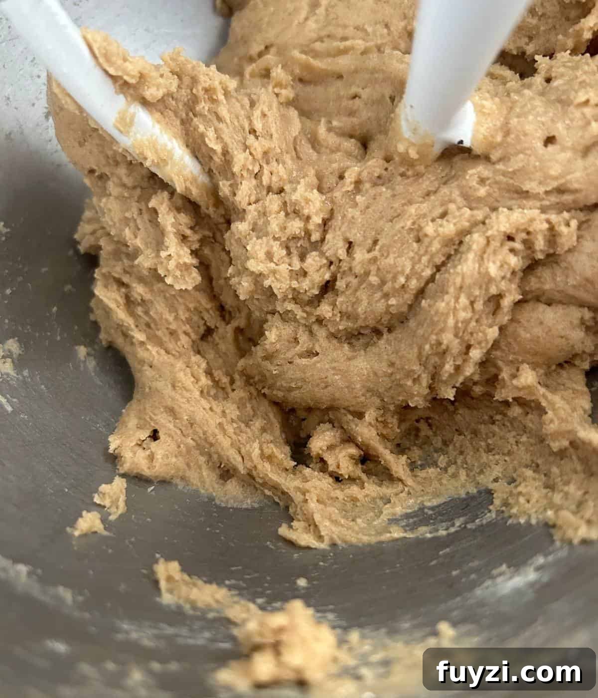 Cookie dough in stand mixer.