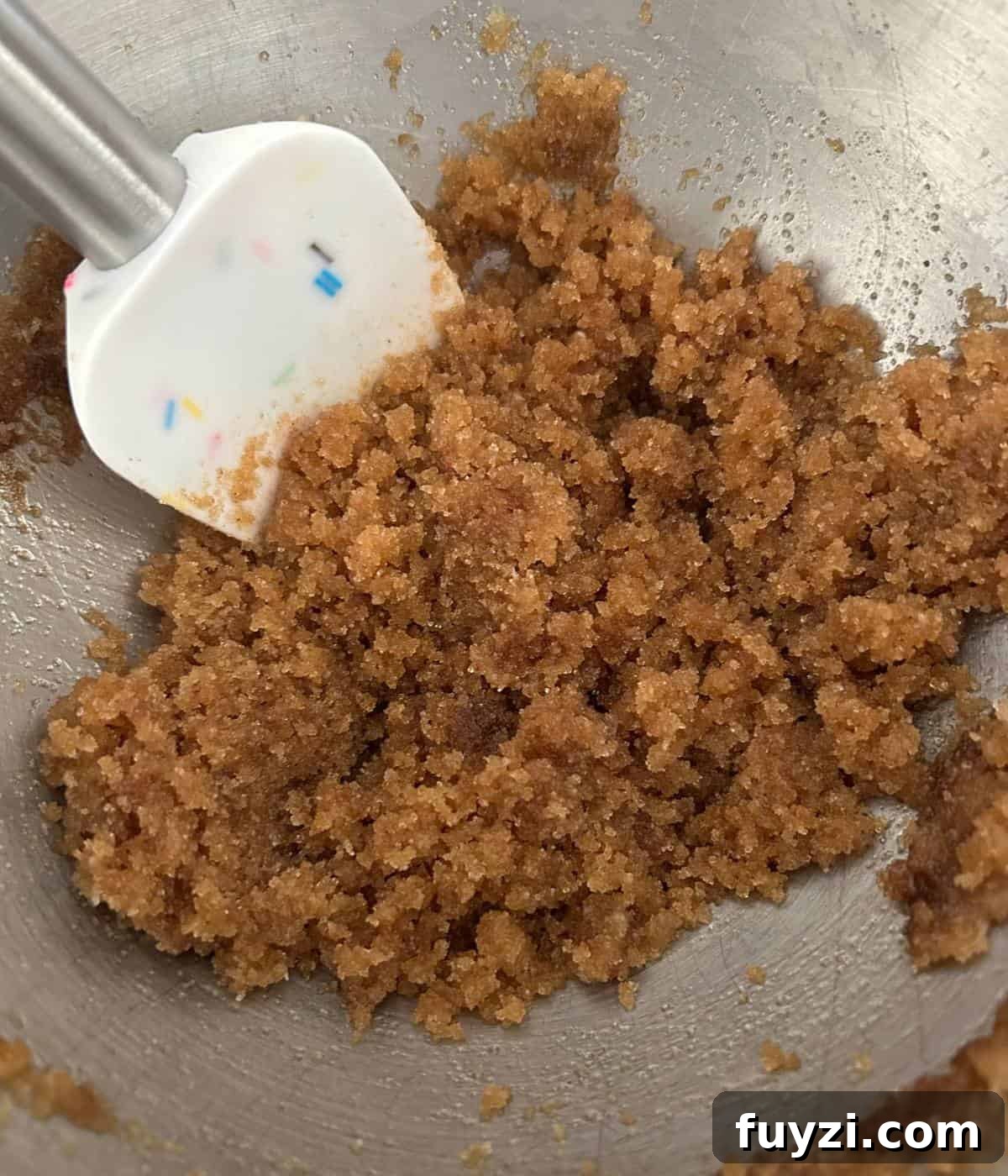 Butter and sugar mixed in bowl.