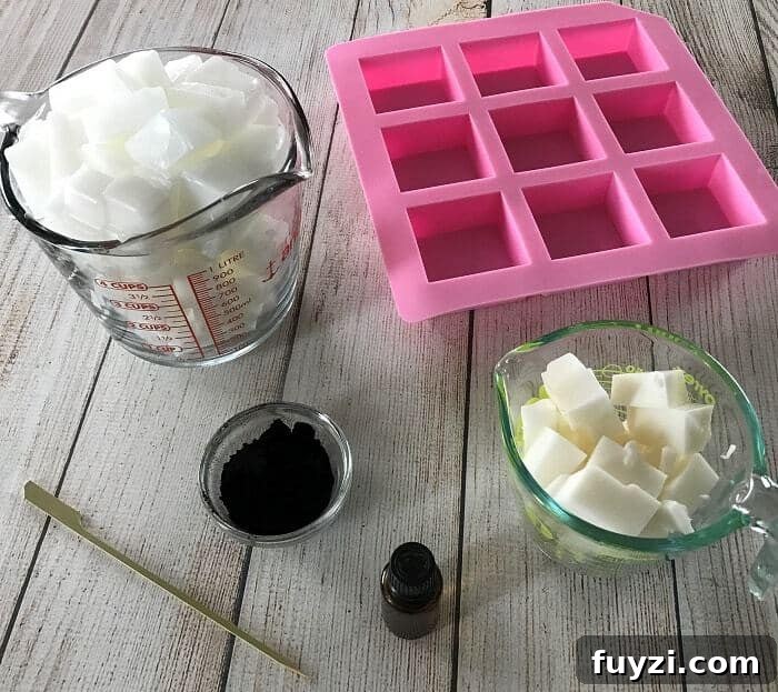 Easy DIY peppermint & charcoal detox soap recipe with peppermint essential oil. Helps increase circulation, unclogs pores, remove impurities, fight acne, and improve the health of your skin. {essential oils for skin, acne, faces, tightening, skincare, Young Living, doTERRA, activated charcoal, melt and pour soap} #essentialoils #essentialoilrecipes #essentialoilDIY #naturalDIY #essentialoilsoap #charcoalsoap #facesoap #charcoalfacesoap #peppermintessentialoil #homemadesoap