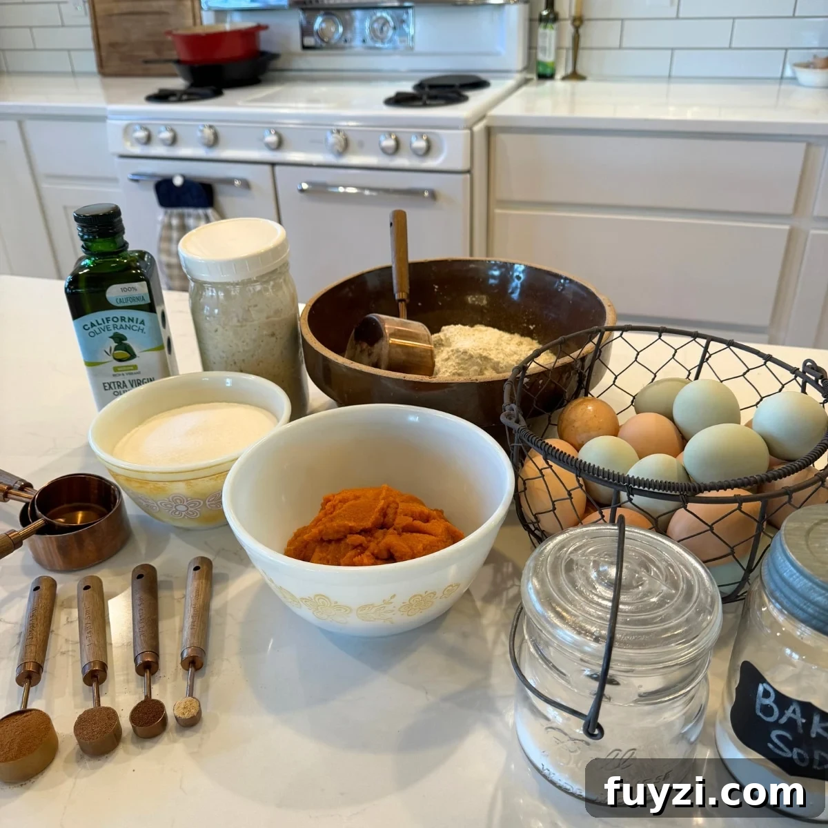How to Make Moist Sourdough Pumpkin Bread 3 oil, sourdough starter, flour, sugar, cinnamon, ginger, cloves, nutmeg, pumpkin puree, salt, baking soda, eggs