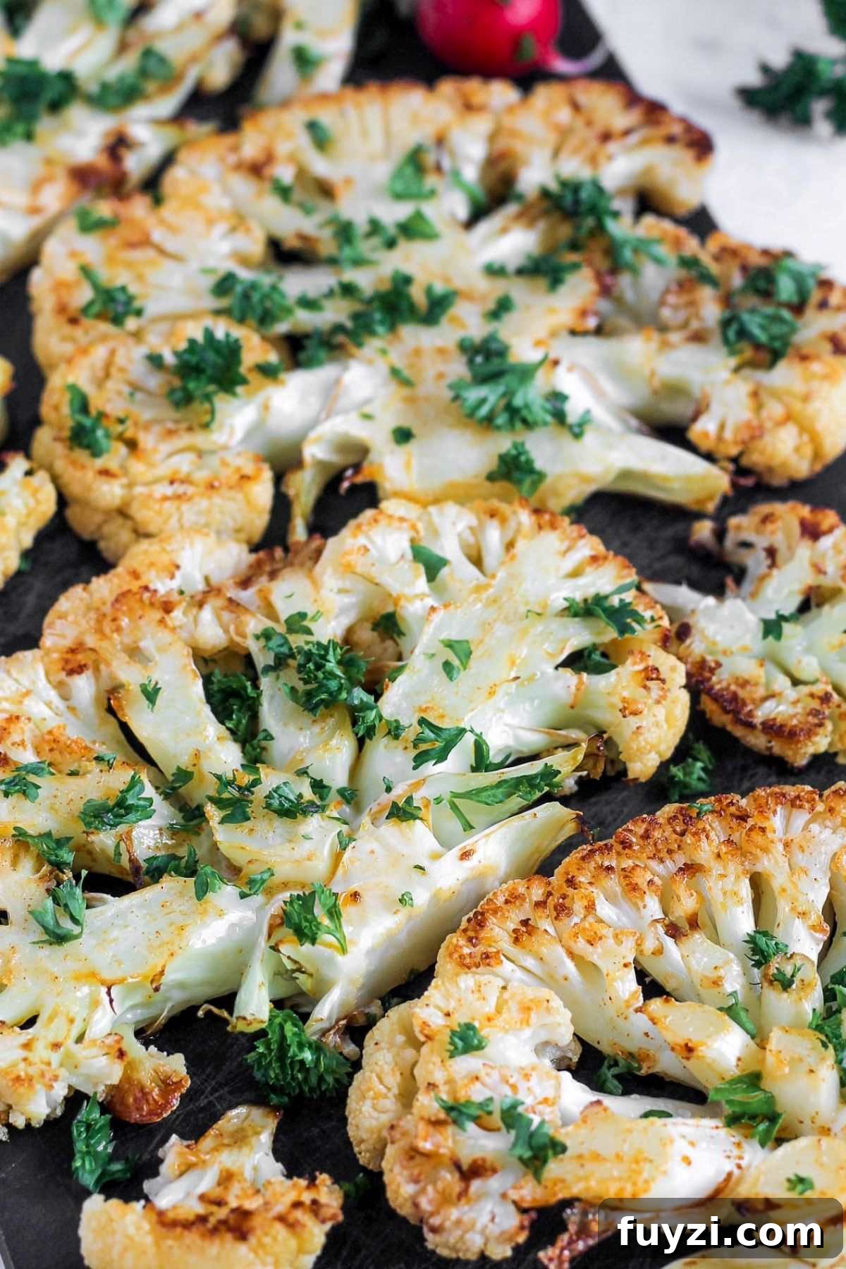 Vegan Roasted Cauliflower Steaks with Garlic-Herb Sauce 6 Close up of roasted cauliflower steaks to show texture.