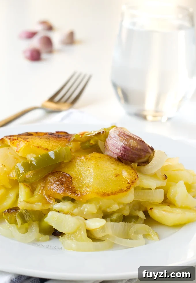 Patatas a lo Pobre (Poor Man's Potatoes). Patatas a lo pobre (poor man's potatoes) is a typical Spanish recipe and it's vegan. You only need 6 ingredients to make this delicious recipe | minimaleats.com #minimaleats #vegan #glutenfree