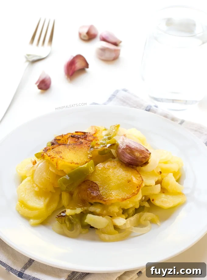 Patatas a lo Pobre (Poor Man's Potatoes). Patatas a lo pobre (poor man's potatoes) is a typical Spanish recipe and it's vegan. You only need 6 ingredients to make this delicious recipe | minimaleats.com #minimaleats #vegan #glutenfree