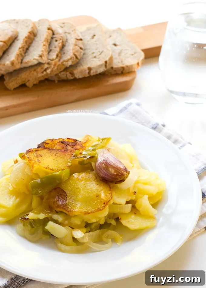 Patatas a lo Pobre (Poor Man's Potatoes). Patatas a lo pobre (poor man's potatoes) is a typical Spanish recipe and it's vegan. You only need 6 ingredients to make this delicious recipe | minimaleats.com #minimaleats #vegan #glutenfree