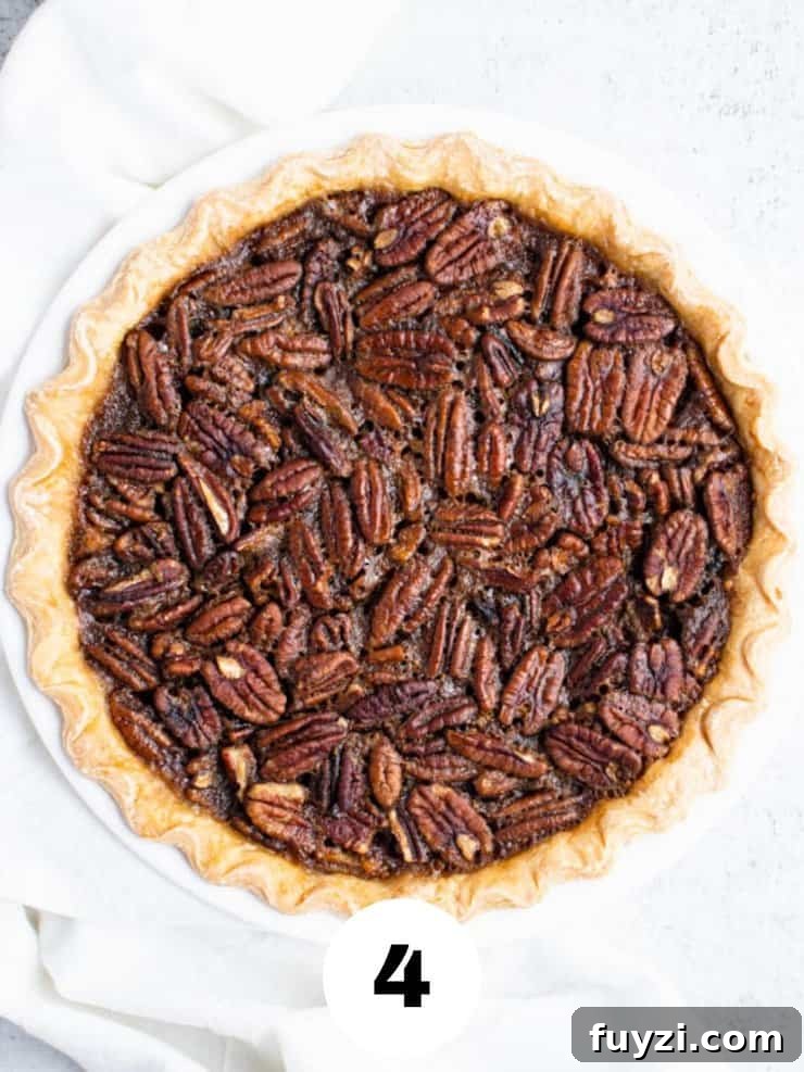 How to Make Bourbon Pecan Pie Without Corn Syrup 6 Overhead view of baked bourbon pecan pie.