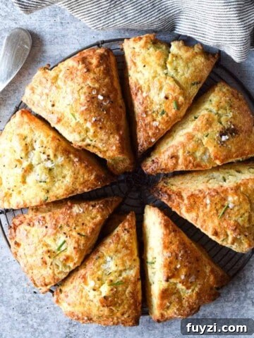 Gorgonzola and Pear Grilled Cheese Recipe with Jam 12 Overhead view of smoked gouda and chive scones cut in eight triangles on a concrete gray background