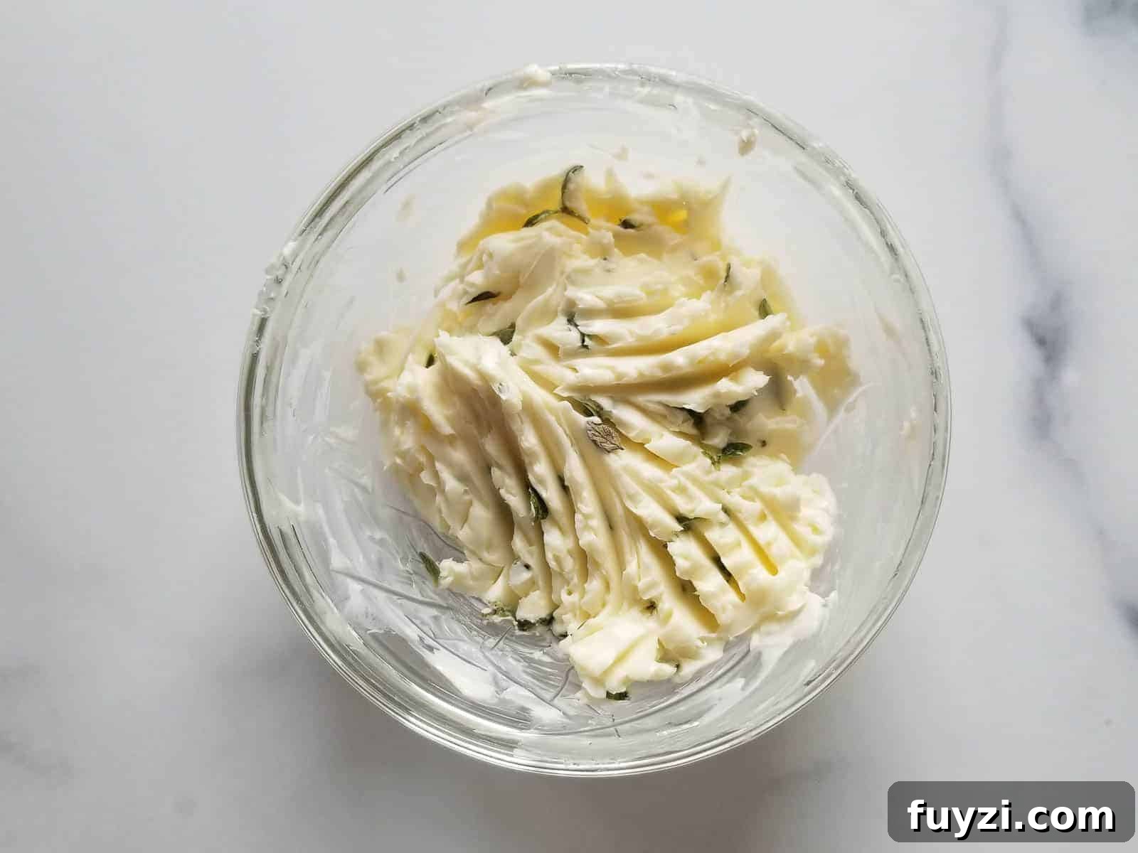 Gorgonzola and Pear Grilled Cheese Recipe with Jam 4 Butter mixed with thyme in a small bowl.