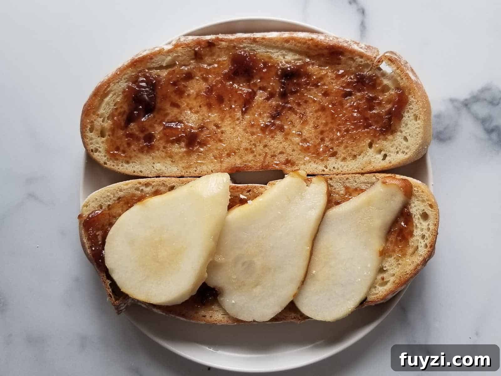 Gorgonzola and Pear Grilled Cheese Recipe with Jam 5 Cut pears on two slices of bread with fig jam.