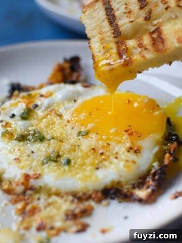 Gorgonzola and Pear Grilled Cheese Recipe with Jam 10 Fried egg with bread being dunked in a runny yolk.