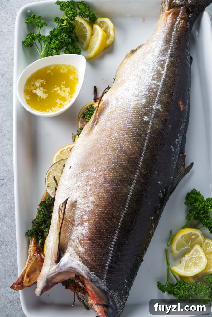 Grill a Whole Salmon: Step-by-Step Guide 2 Whole salmon stuffed with citrus and aromatics on serving platter