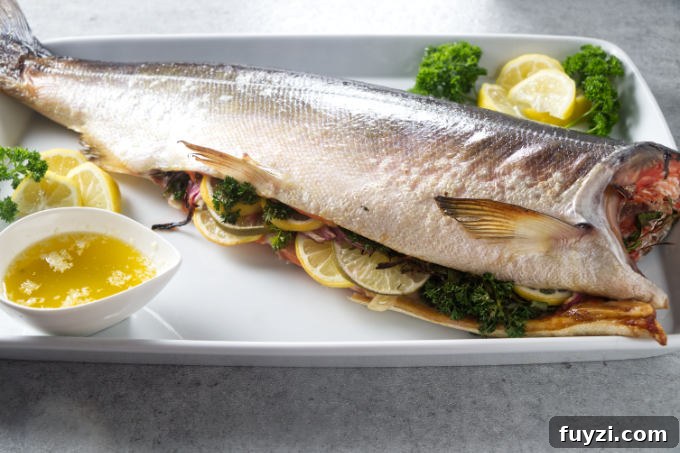 Grill a Whole Salmon: Step-by-Step Guide 3 Whole salmon stuffed with citrus and aromatics on serving platter
