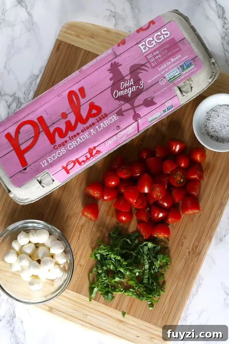 Caprese baked eggs with tomatoes and mozzarella