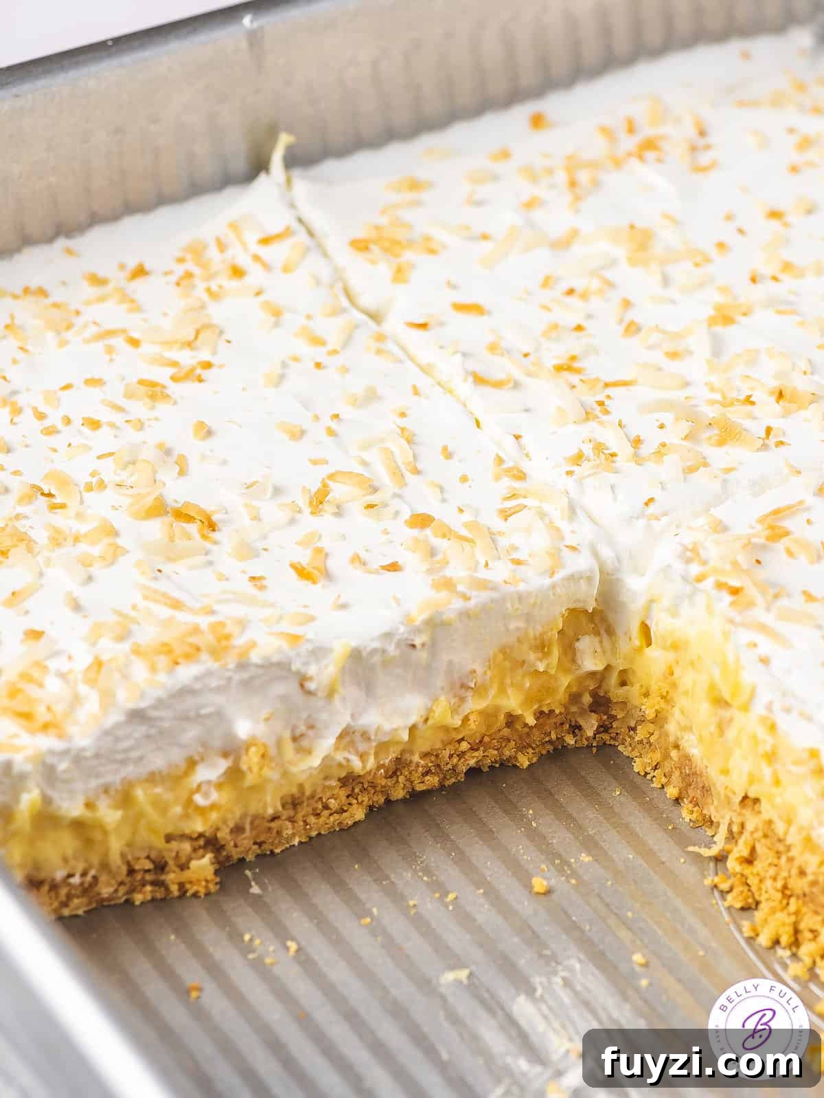 sliced pineapple lush dessert in pan