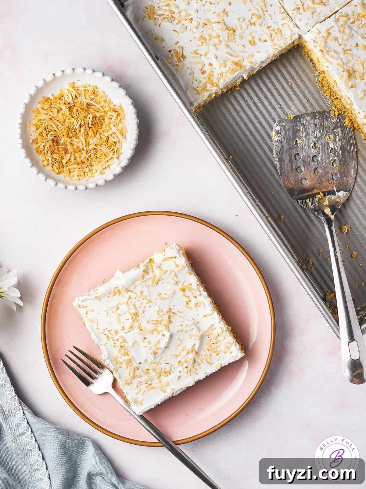 square slice of pineapple lush on plate with fork