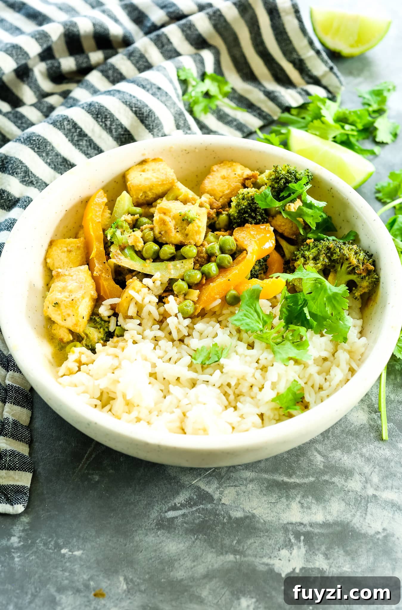 a bowl of Thai Green Curry recipe with cilantro and rice