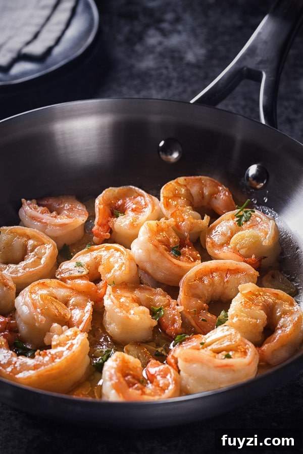Plump, succulent shrimp sautéed in an aromatic garlic butter - a perfect dinner in minutes. Watch for these visual cues for perfectly cooked soft shrimp!