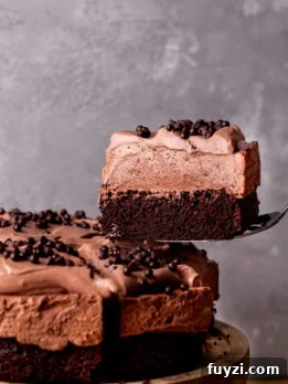 Taking a slice out of the chocolate mousse cake.