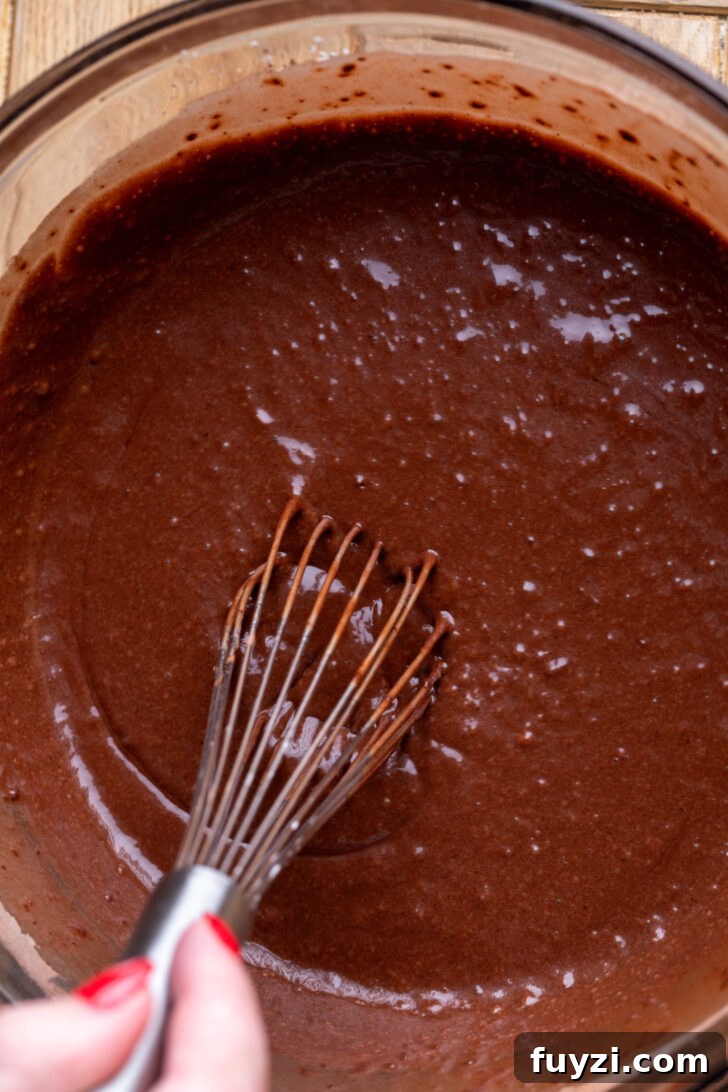 Chocolate cake batter in a bowl.
