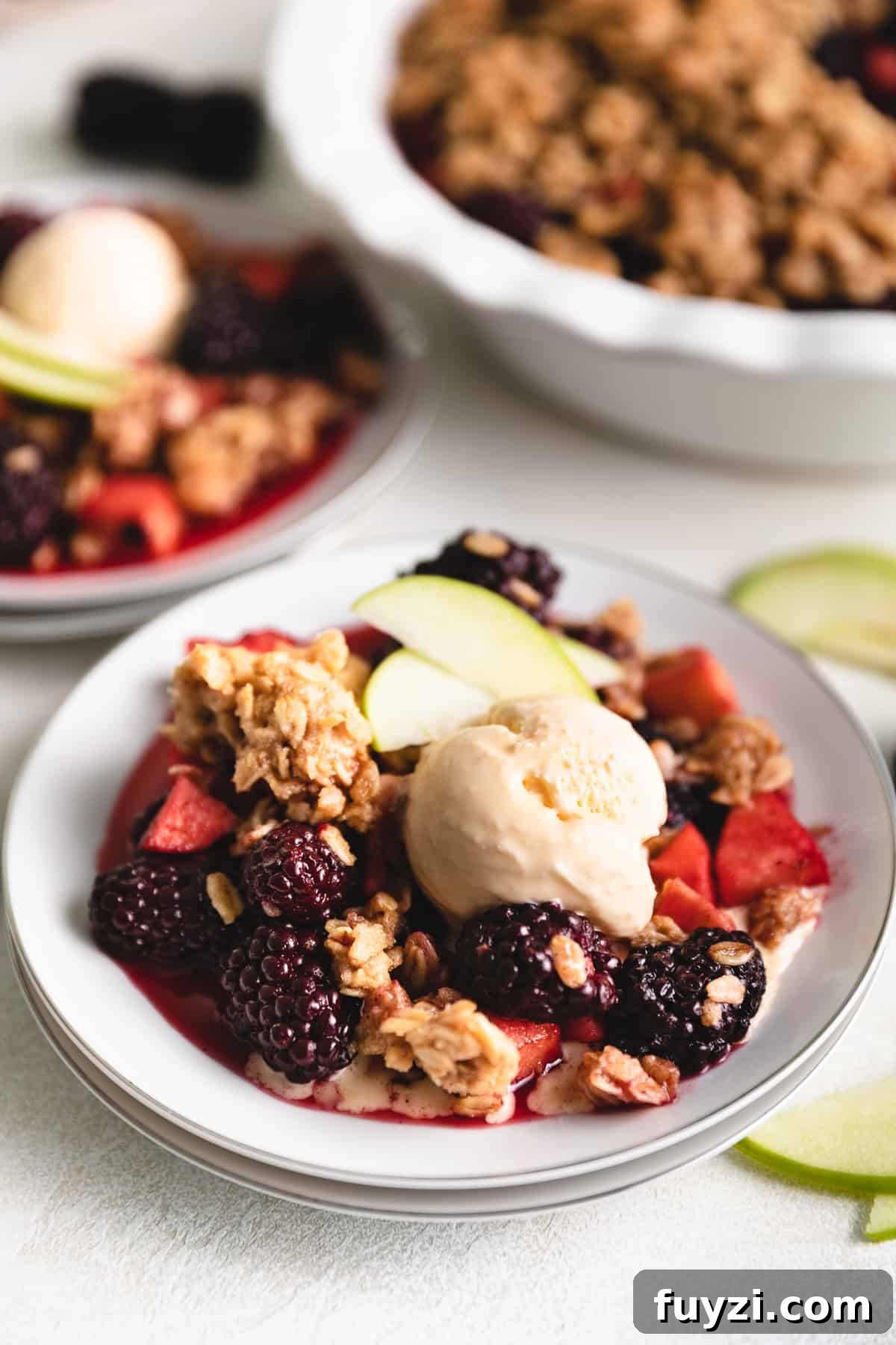 Scoop of vanilla ice cream on crumble.