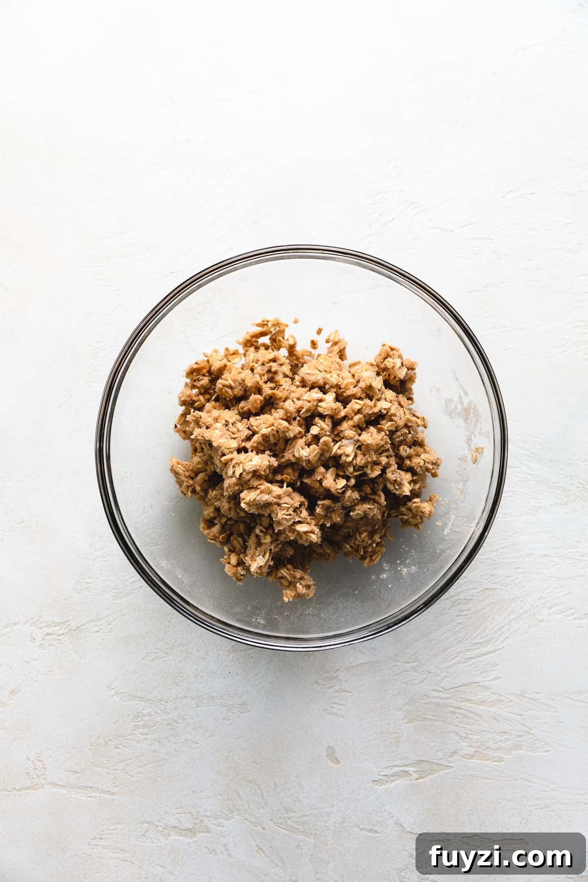 Top down view of crumble topping in a bowl.