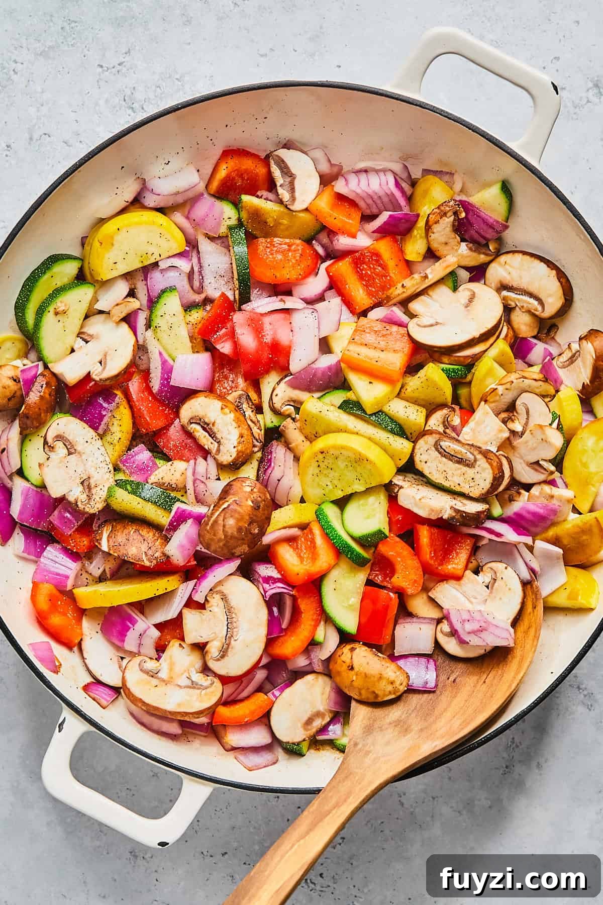 Skillet Chicken and Apple Sausage Stir Fry Recipe 7 Fresh vegetables sautéing in skillet with olive oil