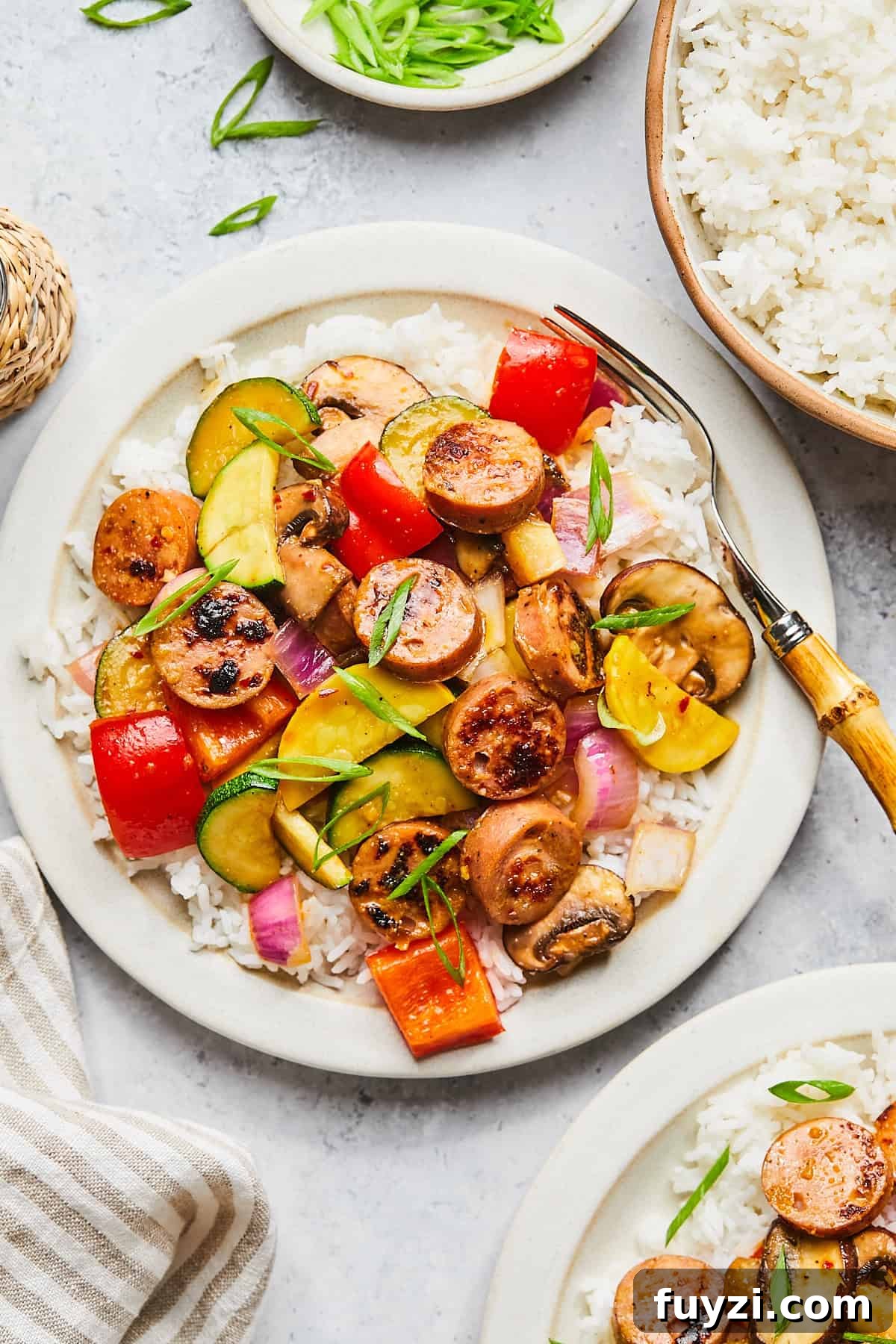Skillet Chicken and Apple Sausage Stir Fry Recipe 10 Finished sausage stir fry served over rice with green onions