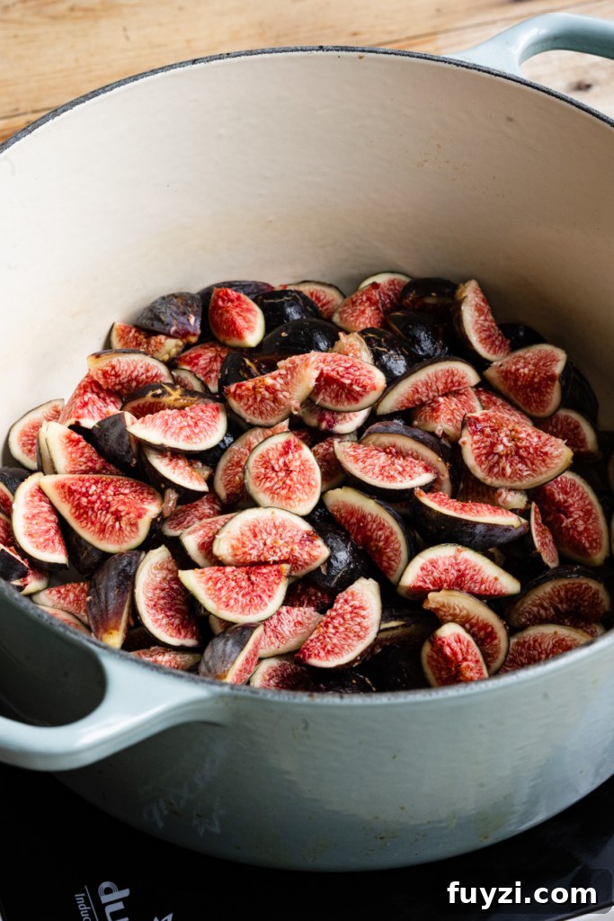 Homemade Fig Jam: Small-Batch Recipe 4 Large cooking pot filled with sliced figs.