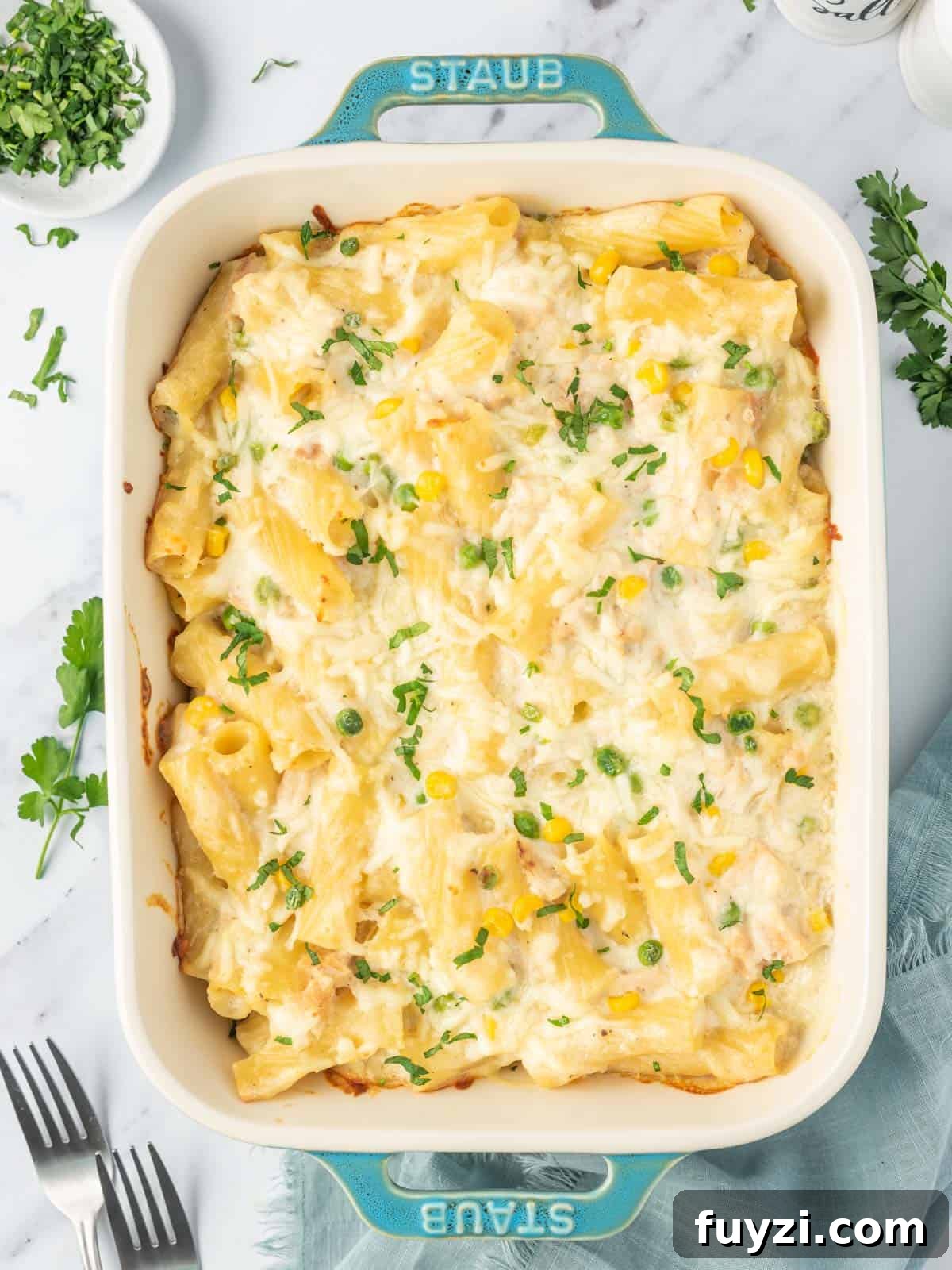 Creamy Tuna Pasta Bake with Crispy Cheesy Crust 2 Easy tuna noodle casserole recipe in a baking dish.