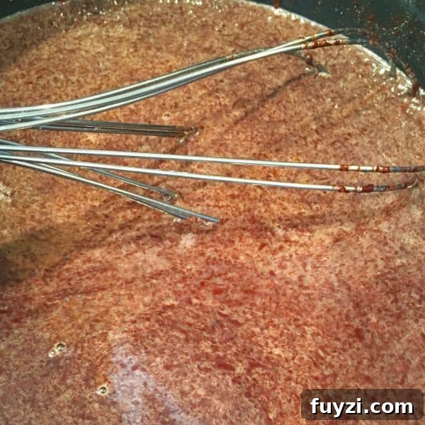 chocolate melting into milk mixture in sauce pan