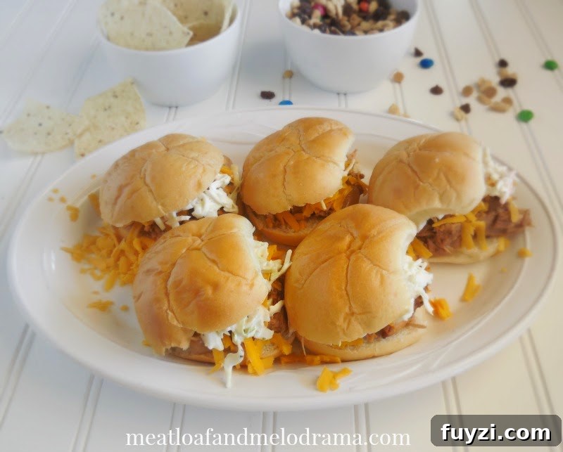 pulled pork sliders with cheese and coleslaw for game day