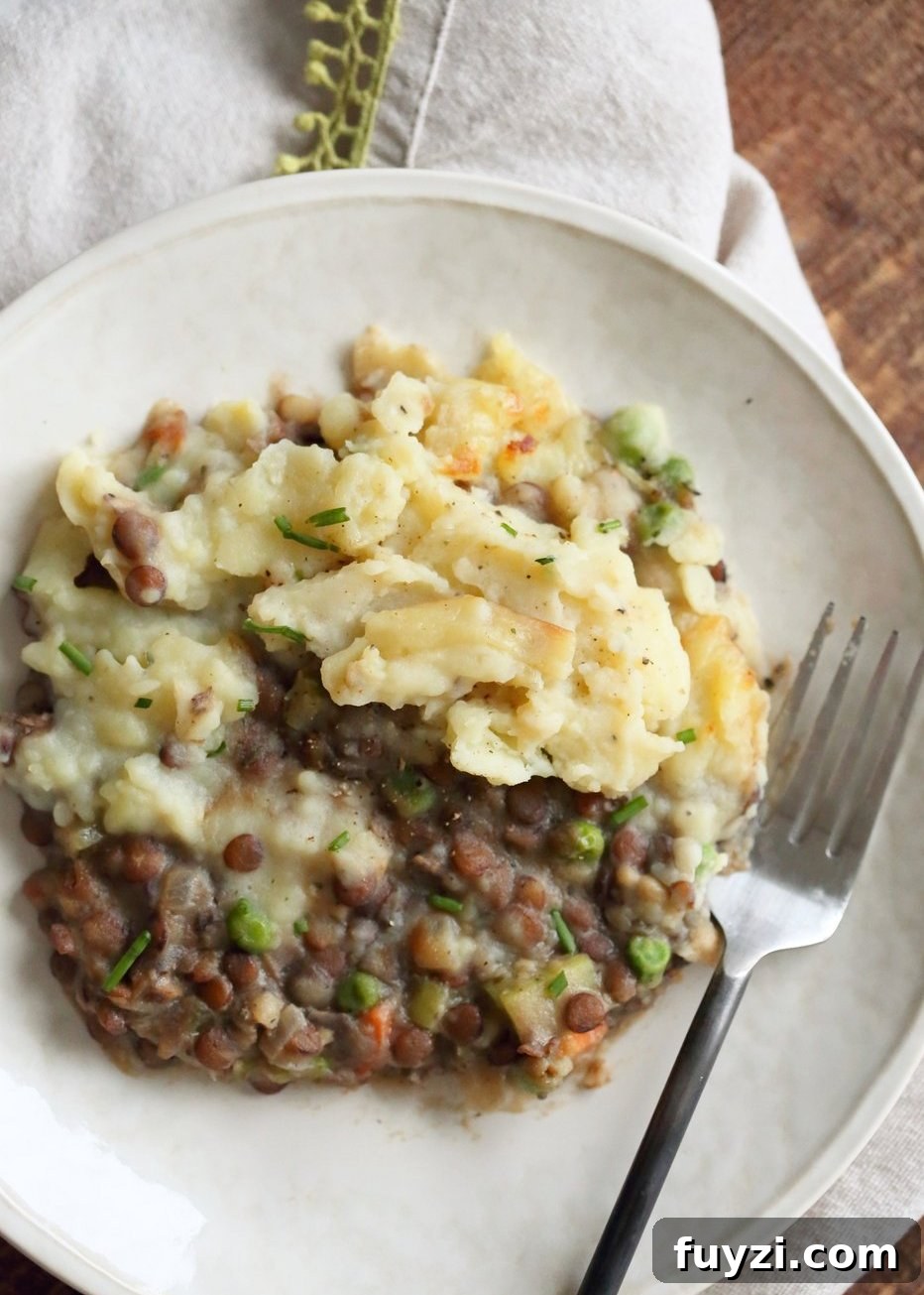 Vegan Lentil Shepherd's Pie - Mushroom and Lentil Shepherdless Pie with Gravy and Garlic mashed potatoes.