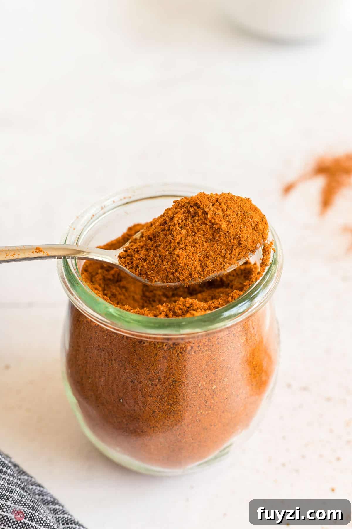 jar of seasoning with spoon